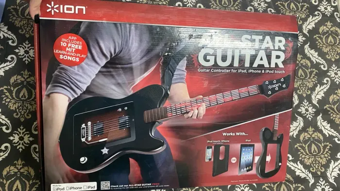 iPad com guitarra elétrica All-Star guitar