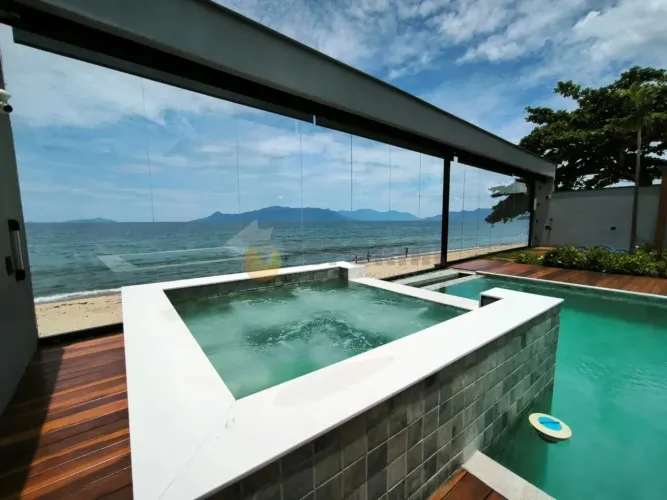 Casa pé na areia com 3 suites à venda, 236 m² por R$ 4.000.000 - Massaguaçu - Caraguatatub