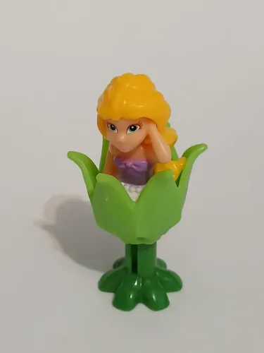 Brinquedo Kinder Ovo Fada loira na flor verde