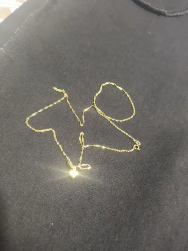 Vendo gargantilha de ouro 18k com pingente.