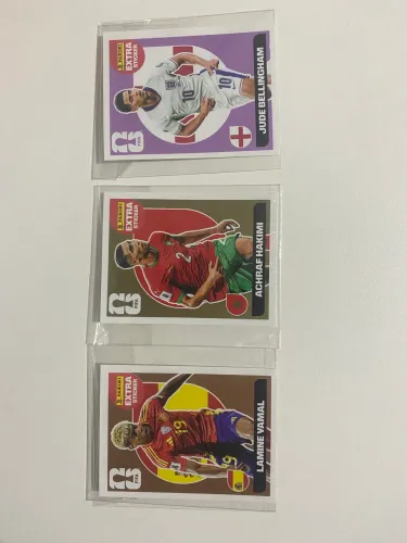 KIT COM YAMAL BRONZE, HAKIMI OURO E BELLINGHAM LILÁS PANINI 2026