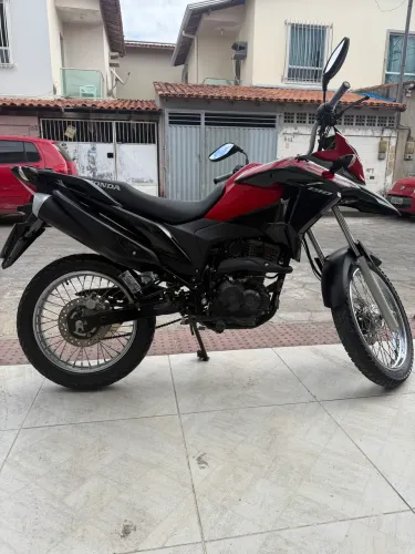 Moto XRE único dono, particular.