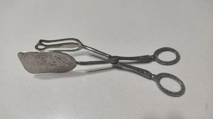 Pegador de prata para antiquários
