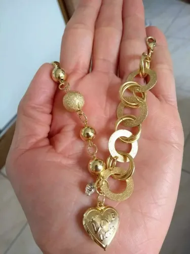 Pulseira de coração dourada