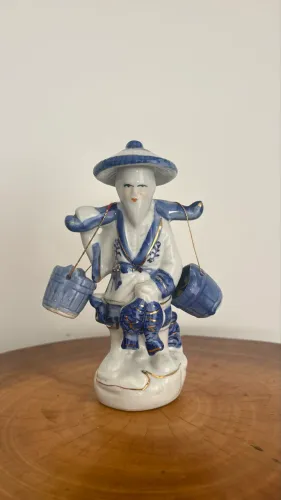Escultura Pescadores em porcelana
