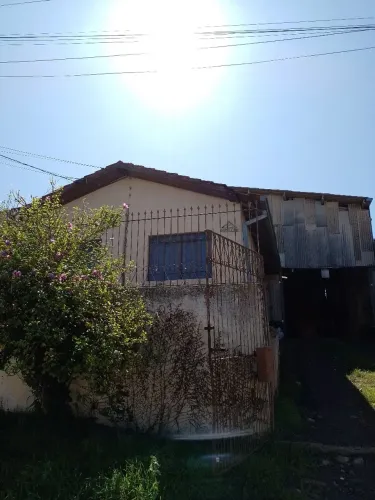Casa alvenaria com barracão anexo