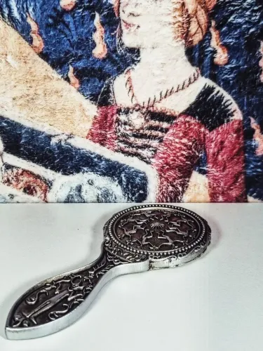 Espelho de mão da Hermione em a Câmara Secreta