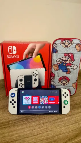 Nintendo Switch OLED Desbloqueado + Cartão SD + Acessórios Completo na Caixa<br>?Descrição: