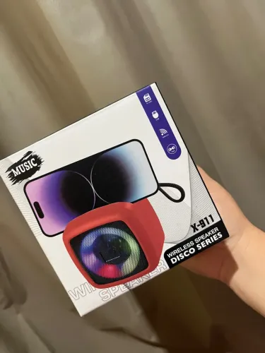 Caixinha de som com suporte para celular 