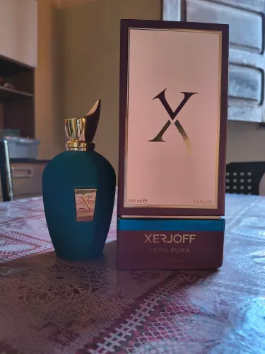 Perfume erba pura usado quase cheio .