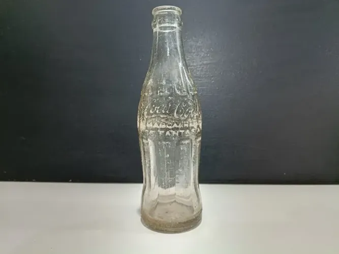 Garrafa antiga de vidro Coca Cola anos 1950