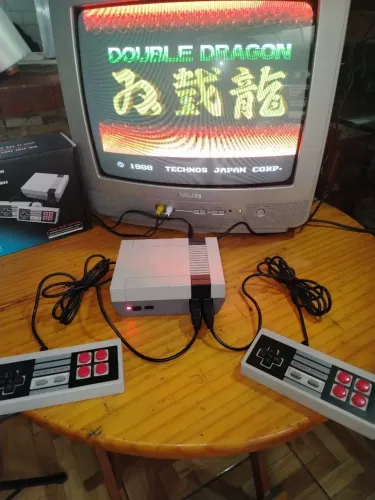 nintendinho 8bits mini 620 jogos + tv 14