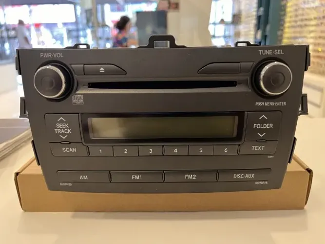 Som ORIGINAL De Corolla CD,Rádio Funcionando NUNCA ABERTO.