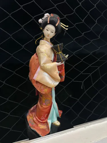 Boneca chinesa em ótimo estado