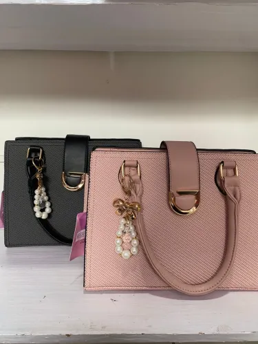 Bolsa de lado de zíper e botão 