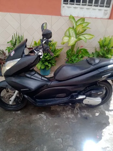 Moto de mulher motor zero pneus novos amortecedor novo .