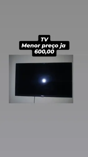 Geladeira sofá e máquina e TV