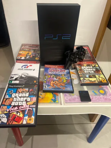 Console ps2 com tudo original ! Console nunca aberto com selo . Venda ou troca 