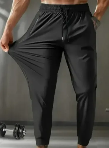 CALÇA ESPORTIVA PRETA- TECIDO LEVE - Barra aberta