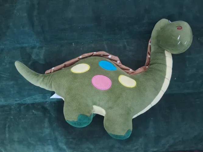 Dinossauro de pelúcia verde