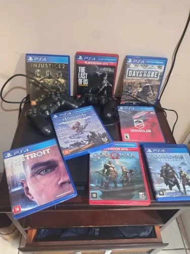 Play station 4 tudo original 2 manetes originais 9 jogos