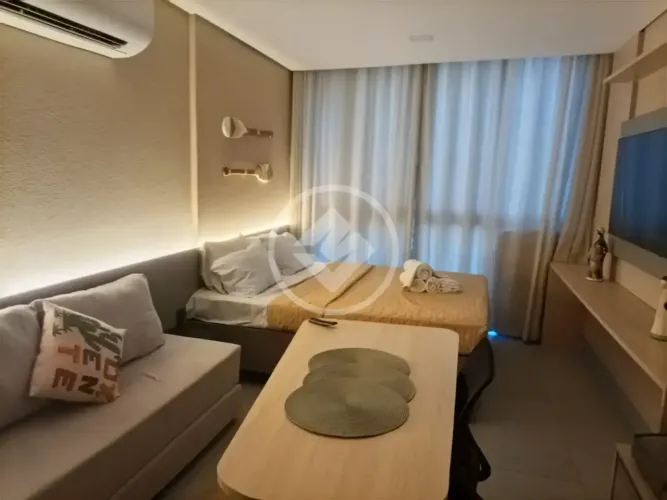 Flat novo e espaçoso com vista lateral mar em prédio pé na areia numa região paradisíaca d