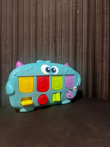 Brinquedo Monstro Surpesa eletronico para bebe da Fisher Price