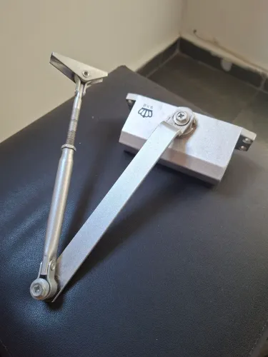 Mola aérea para fechamento de porta automática