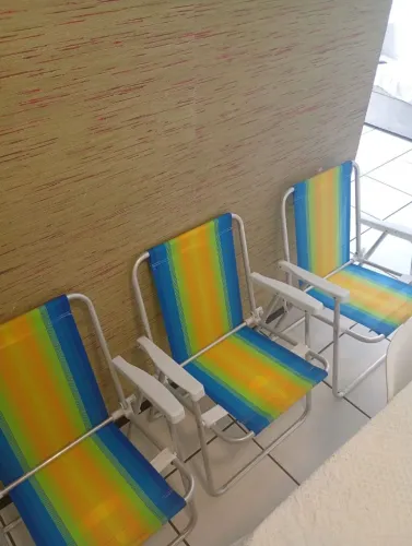 Três cadeiras da praia dobrável