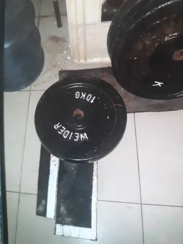 2 Anilhas de 15 kg e 2 de 10kg ferro maciço weider preço final $ 12,00 o kg