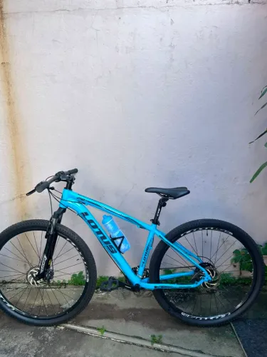 Bicicleta lotus aro 29 + capacete