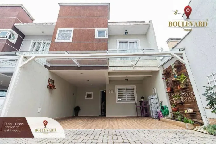 Sobrado em condomínio fechado com 3 dormitórios à venda, 144 m² por R$ 730.000 - Xaxim - C