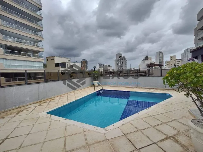 Apartamento com varanda e lazer na Praia da Enseada, Guaruja