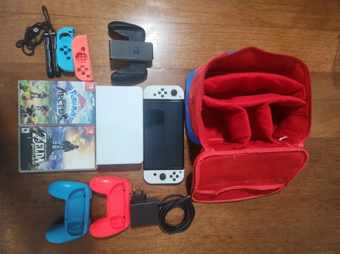 Vendo Console Nintendo Switch OLED com acessório e jogos