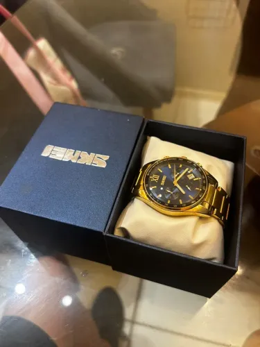 Relógio skmei dourado e azul