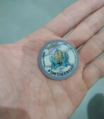 Tazo pokémon holográfico (número 70)