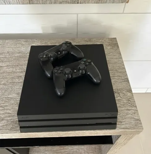 Ps4 pro + dois controles e jogos