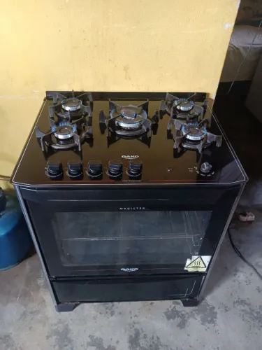 Fogão Dako mesa de vidro funcionando perfeitamente acendimento automático luz no forno ok