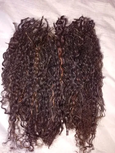 Cabelo humano cacho fechado.serve pra manutenção.35/40.cabelo já vai megado..