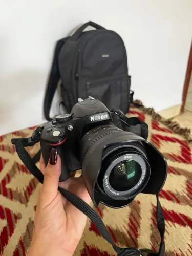 Câmera Nikon D5100 DSLR + Lente 18-55mm VR + Bolsa ? R$ 1.200
