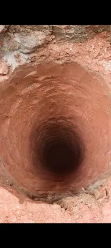 Furador de tubulão manual