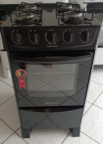 Fogão atlas 4 bocas manual mesa de vidro muito bem conservado..