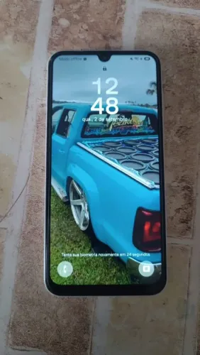 Celular A 15 e caixa de som