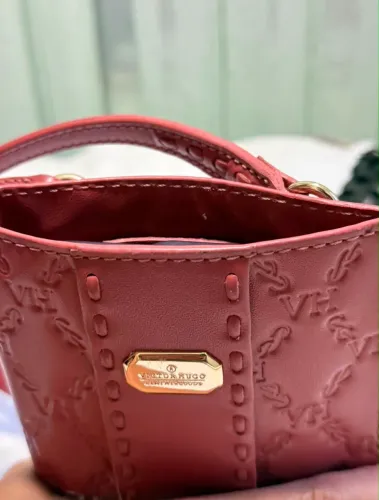 Bolsa porta celular Victor Hugo rosé