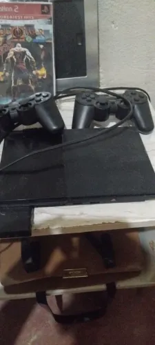 Vendo ps2 funcionando perfeitamente com dois controles sem fio leitor pegando normal