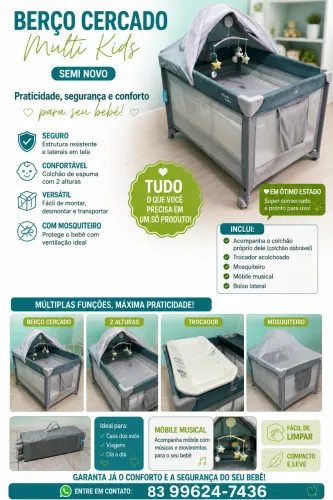 Berço cercado com trocador e móbile.