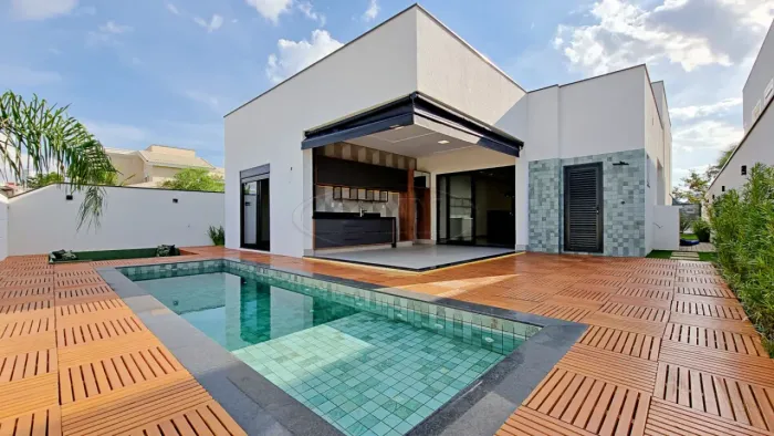 Casa MARAVILHOSA com 3 suítes, piscina e fire place no Alphaville Nova Esplanada 1 - Votor