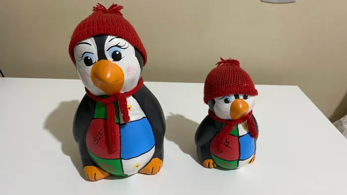 Duplinha de pinguim de cerâmica 