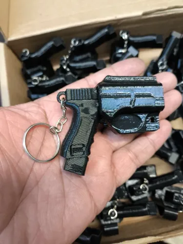 CHAVEIRO PETECO PETECO MINIATURA ARMA GLOCK COM COLDRE 