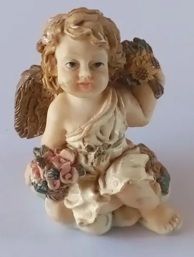 Bibelô em resina miniatura.